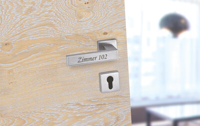 Türdrücker mit Inlay