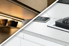 Beleuchtete Küchenzeile und eine Steckdose mit Kabel